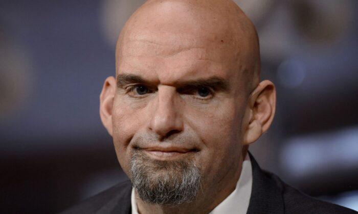 Sen. John Fetterman (D-Pa.) is ceremonially sworn in for the 118th Congress at the Capitol in Washington, on Jan. 3, 2023. (Olivier Douliery/AFP via Getty Images)