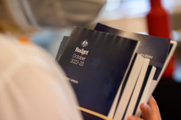 Copies of the 2022-23 budget papers are handed out to members of the press in Canberra, Australia, on Oct. 25, 2022. (Martin Ollman/Getty Images)
