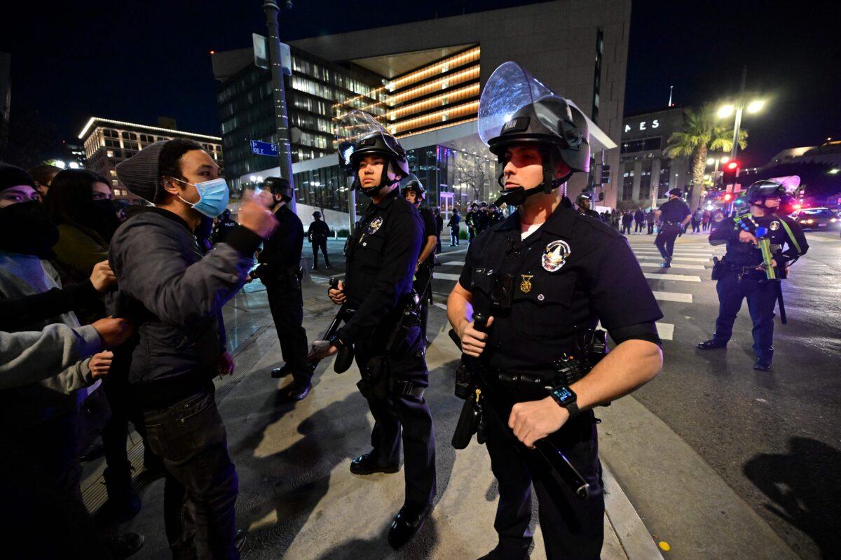 Protesters face off with a line of police officers during a rally against the fatal police assault of Tyre Nichols, outside the LAPD headquarters in Los Angeles on Jan. 27, 2023. (Frederic J. Brown/AFP via Getty Images)