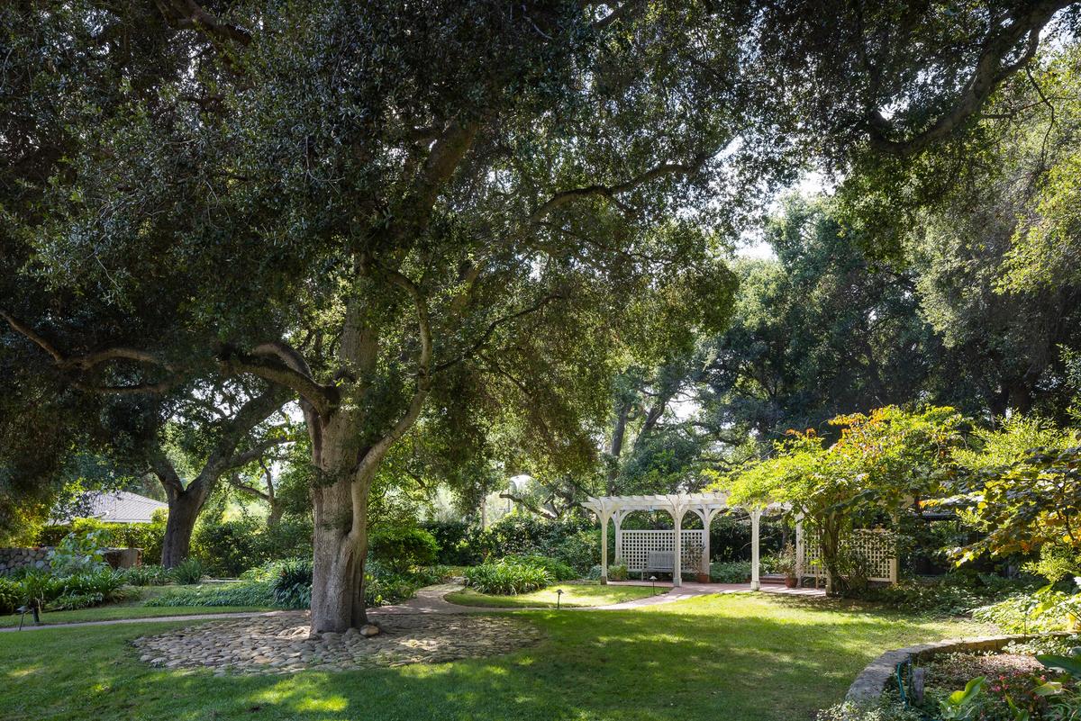 Mature hardwood and fruit trees dot the manicured lawn, attracting birds while providing shade to the grounds and gazebo. (Matt Wier for Sotheby’s International Realty)