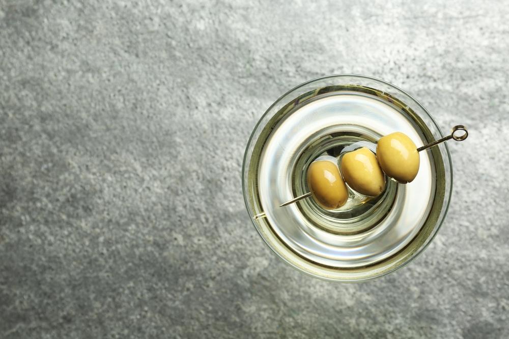 Olives are the classic garnish; the popular dirty martini goes further with a splash of olive brine. (New Africa/Shutterstock)