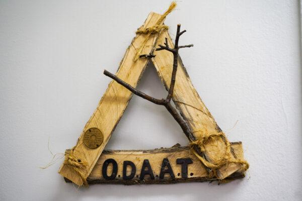 A woodwork bearing O.D.A.A.T, which stands for "one day at a time," at the Sober Village in the Town of Deerpark, N.Y., on Jan. 25, 2023. (Cara Ding/The Epoch Times)