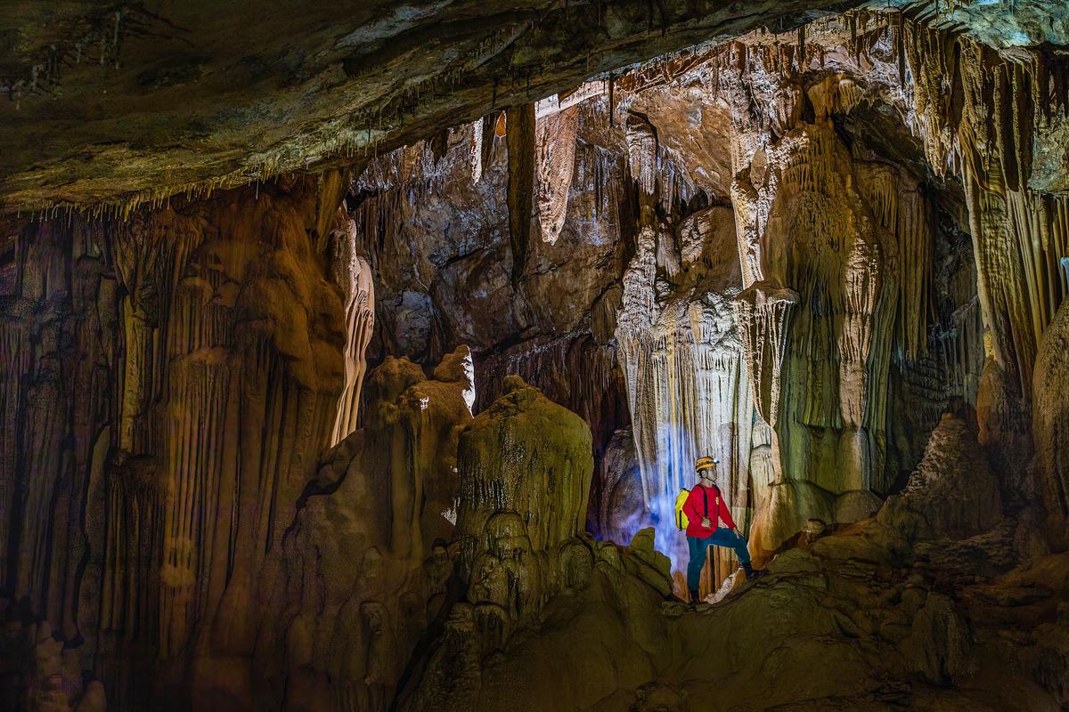 An explorer seen inside Hung Cave. (Courtesy of Duc Thanh via Jungle Boss Tours)