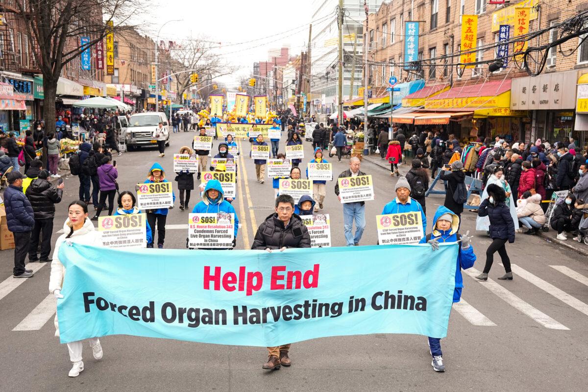 Falun Gong practitioners walk in a parade highlighting the Chinese regime's persecution of their faith, in Brooklyn, N.Y., on Feb. 26, 2023. (Larry Dye/The Epoch Times)