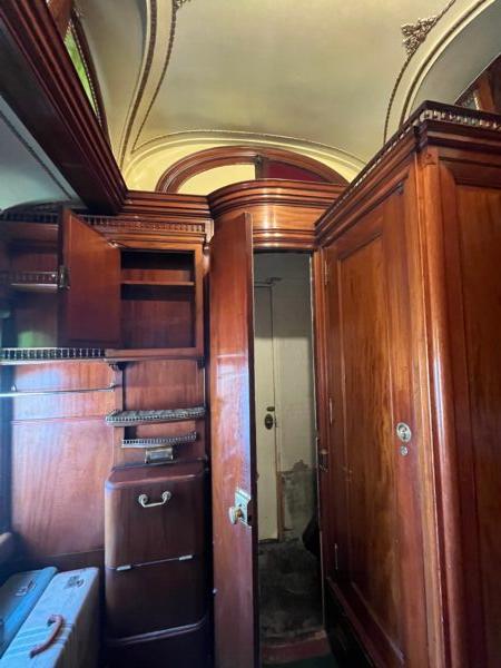 Attention to detail on the opulent "palace car," currently open to the public in West Yellowstone, Mont., extended to the dressing room, with brass rods and knobs and hand-carved wooden storage compartments. (Courtesy of Deena Bouknight)