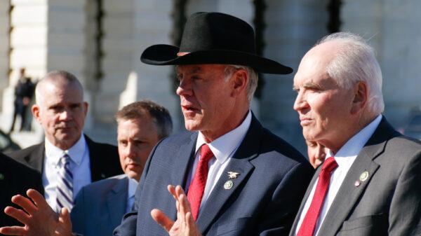 Reps. Ryan Zinke (R-Mont.) (L) and Mike Kelly (R-Pa.) (R) speak at a conference launching the Northern Border Security Caucus at the House Triangle in Washington on Feb. 28, 2023. (Madalina Vasiliu/The Epoch Times)