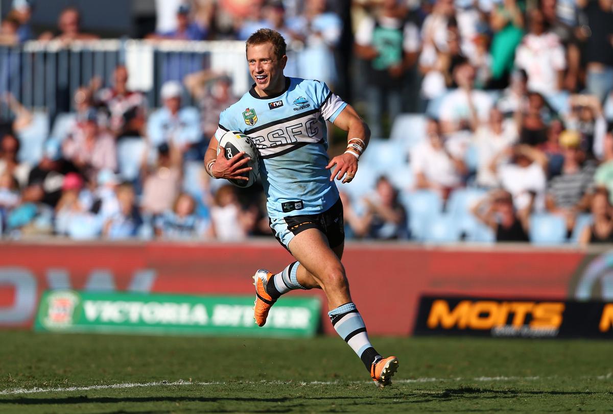 Nathan runs in his fourth try during the round five NRL match between the Cronulla-Sutherland Sharks and New Zealand Warriors at Remondis Stadium on April 5, 2014, in Sydney, Australia. (Renee McKay/Getty Images)