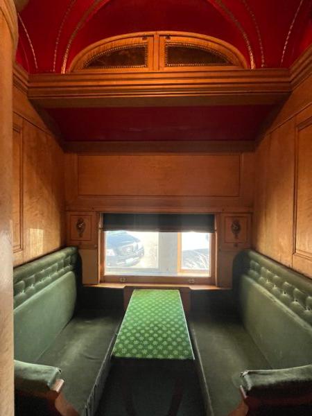 The seating cars included comfortable velvet-covered upholstery set against solid wood paneling and a large window for experiencing the view. (Courtesy of Deena Bouknight)