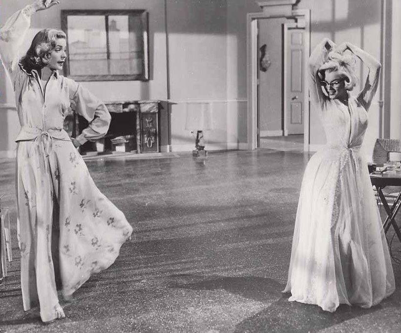 Lauren Bacall (L) and Marilyn Monroe in "How to Marry a Millionaire" from 1953. (Public Domain)