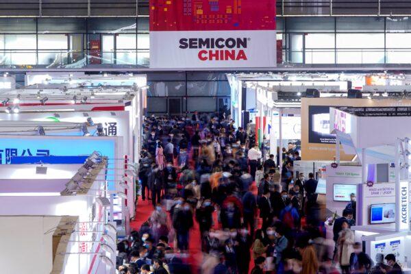 People visit Semicon China, a trade fair for semiconductor technology, in Shanghai on March 17, 2021. (Aly Song/Reuters)