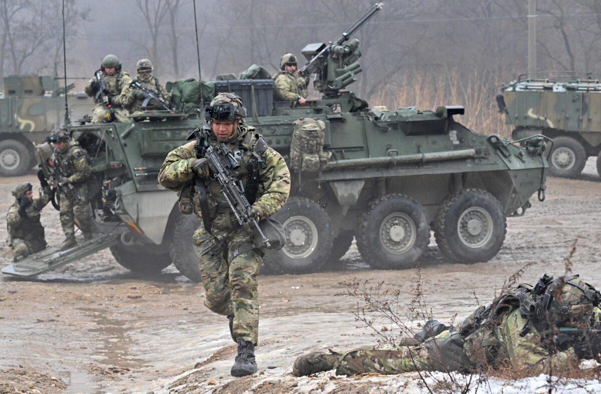 U.S. soldiers participate in a joint military drill between the US 2nd Infantry Division Stryker Battalion and the ROK 25th Infantry Division Army Tiger Demonstration Brigade at a training field in Paju, South Korea, on Jan. 13, 2023. (Jung Yeon-je/AFP via Getty Images)