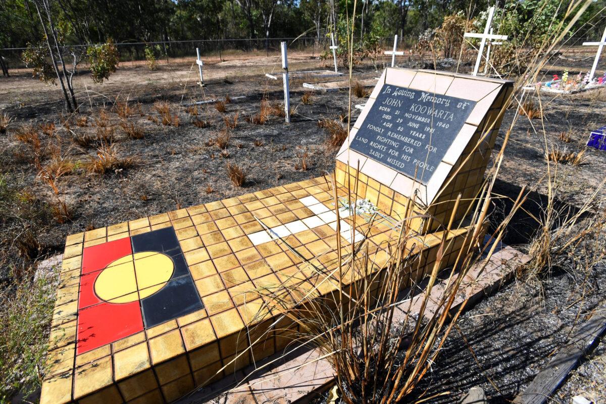 The grave of John Koowarta is seen in Aurukun, far North Queensland, Cape York, on July 19, 2022. (AAP Image/Jono Searle)
