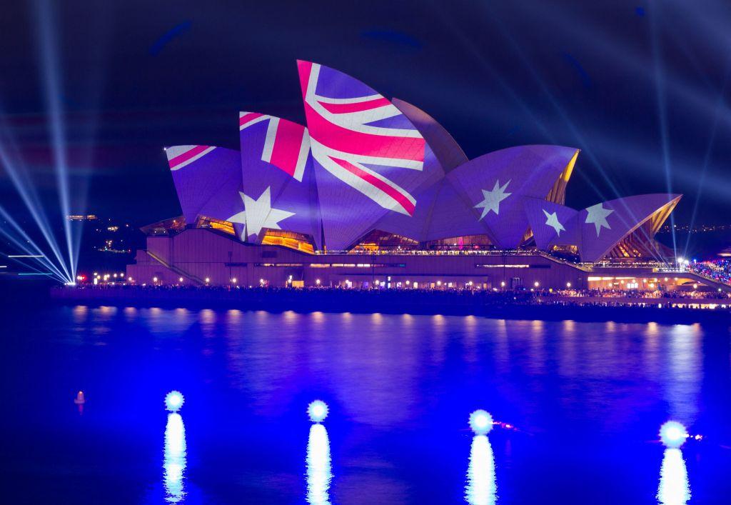 This picture shows the Opera House illuminated in the colours of the Australian flag in Sydney on Australia Day on Jan. 26, 2023. (Robert Wallace/AFP via Getty Images)