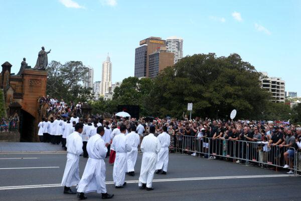 Members of the church form a procession leading the hearse carrying Cardinal George Pell outside St. Mary’s Cathedral along College Street on February 02, 2023 in Sydney, Australia. (Photo by Lisa Maree Williams/Getty Images)