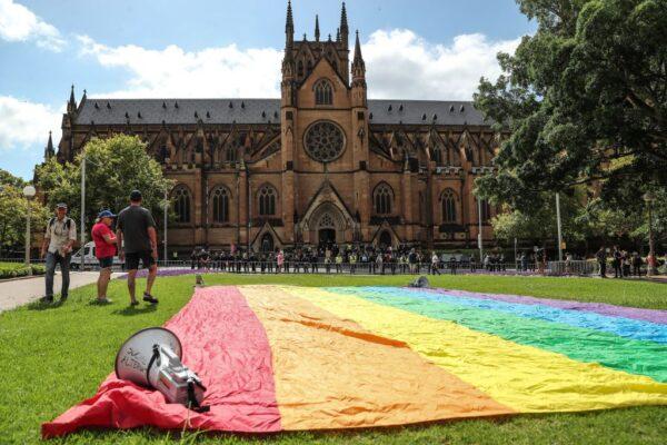 LGBTQ+ community and supporters of clergy abuse victims hold a protest outside St Mary's Cathedral ahead of the pontifical requiem Mass for Cardinal George Pell on February 02, 2023 in Sydney, Australia. (Photo by Roni Bintang/Getty Images)