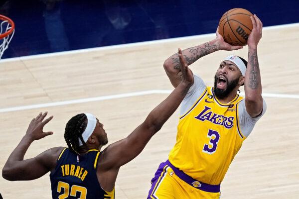 Anthony Davis (3) of the Los Angeles Lakers attempts a shot while being guarded by Myles Turner (33) of the Indiana Pacers in the fourth quarter at Gainbridge Fieldhouse in Indianapolis on Feb. 2, 2023. (Dylan Buell/Getty Images)