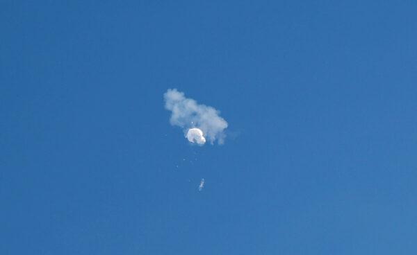 The Chinese spy balloon drifts to the ocean after being shot down off the coast in Surfside Beach, S.C., on Feb. 4, 2023. (Randall Hill/Reuters)