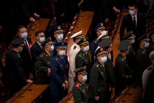 Chinese military delegates leave the closing session of the 20th National Congress of the Chinese Communist Party at The Great Hall of People in Beijing on Oct. 22, 2022. (Kevin Frayer/Getty Images)