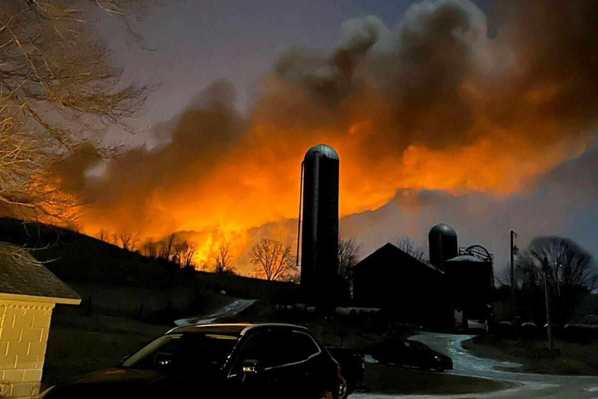 Flames rising from the derailed train are seen from a farm in East Palestine, Ohio, on Feb. 3, 2023. (Melissa Smith via AP)