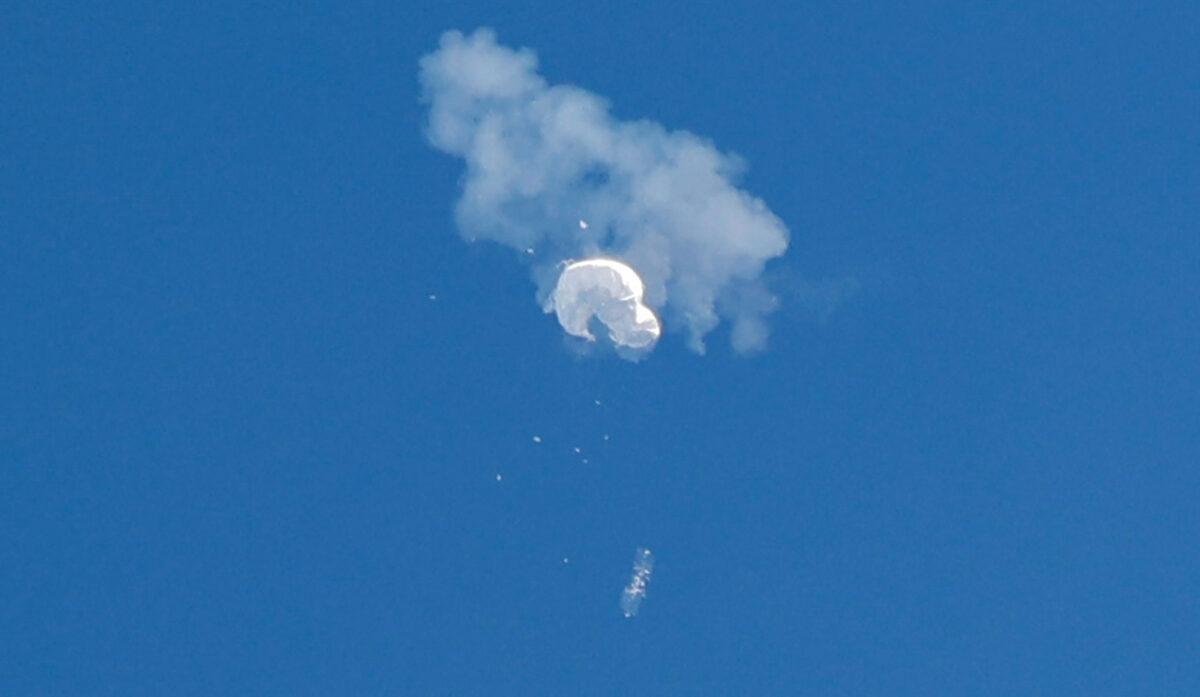 The suspected Chinese spy balloon drifts to the ocean after being shot down off the coast in Surfside Beach, S.C., on Feb. 4, 2023. (Randall Hill/Reuters)