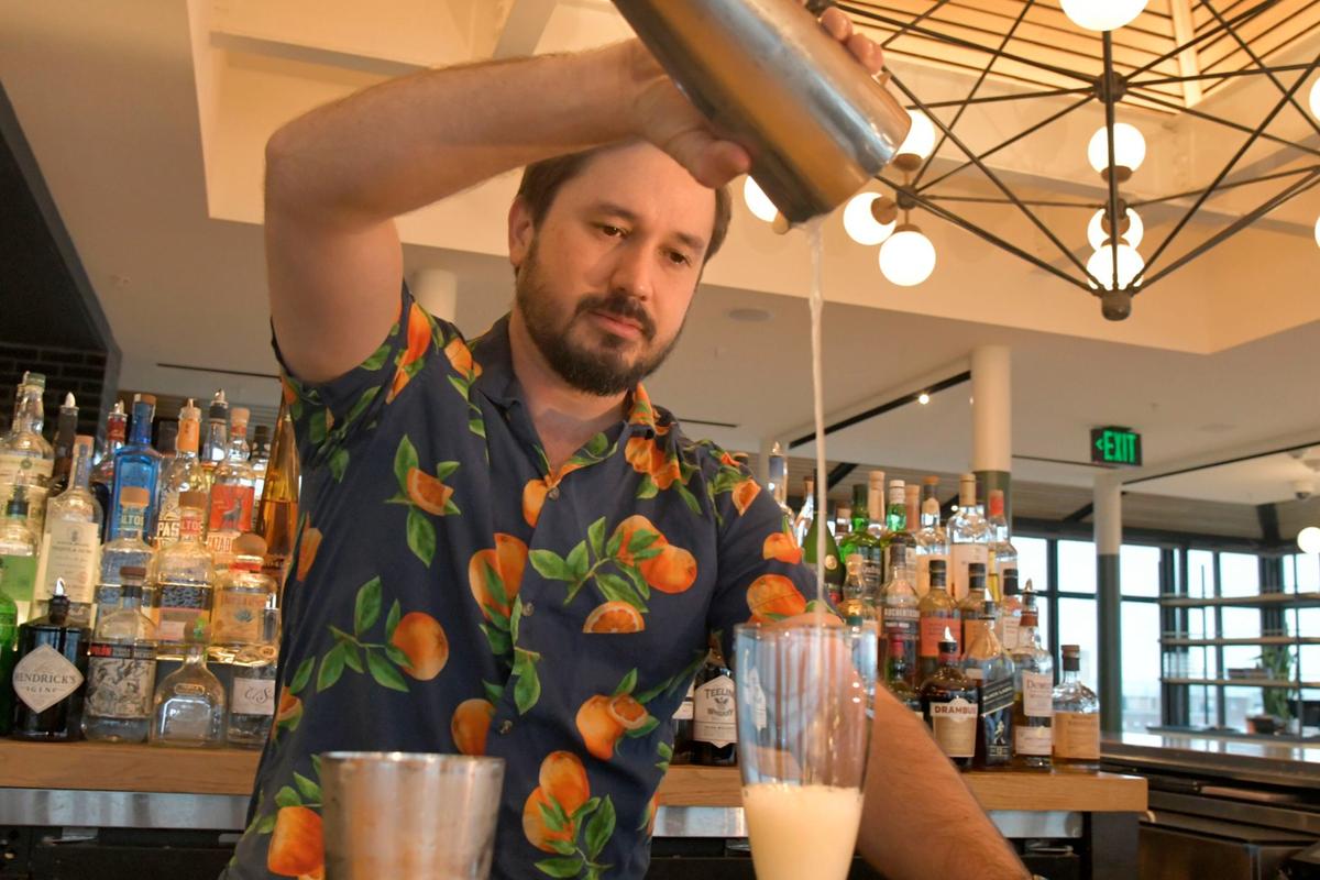 Bartender Christian Parent mixes a spirit-free drink called "Dorothy in the Daytime" at Topside, a restaurant bar on the top floor of Hotel Revival in Mount Vernon. (Amy Davis/The Baltimore Sun/TNS)