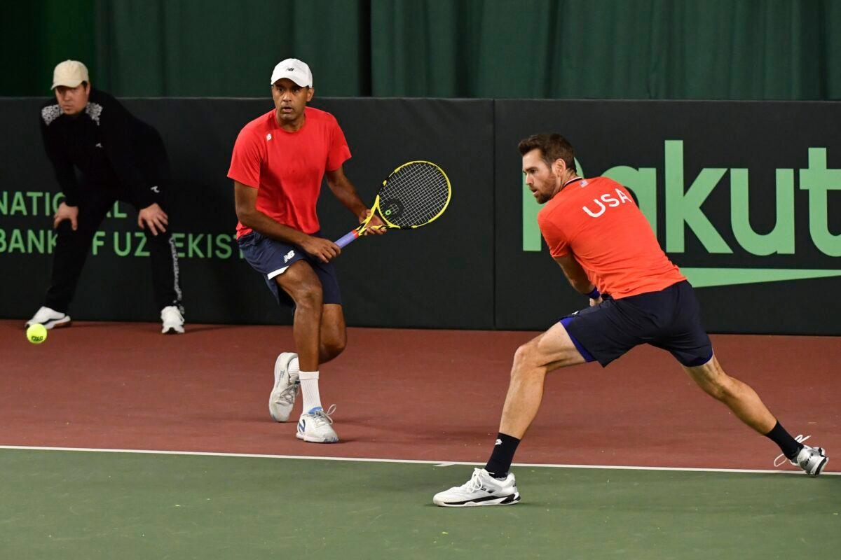 Austin Krajicek (R) and Rajeev Ram of the United States in action against Sergey Fomin and Sanjar Fayziev of Uzbekistan during a doubles Davis Cup qualifier tennis match between Uzbekistan and the United States in Tashkent, Uzbekistan, on Feb. 4, 2023. (AP Photo)
