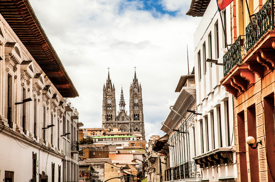 Colonial houses frame a view of the Basilica of the National Vow in Quito. (Lewis Toleti/Shutterstock)