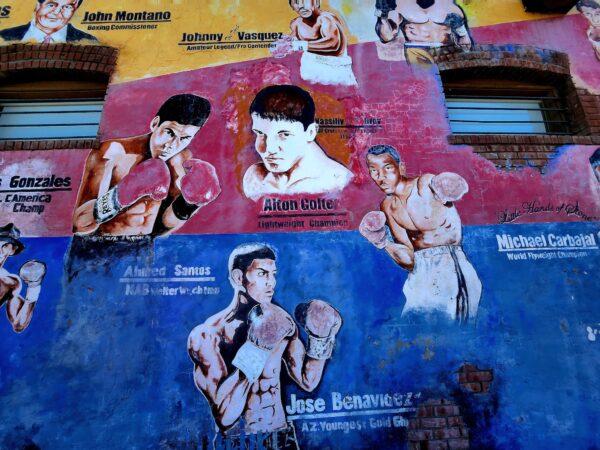 Old boxing greats appear in a colorful wall mural at Central Boxing Gym in Phoenix, Ariz., on Jan. 26, 2023. (Allan Stein/The Epoch Times)