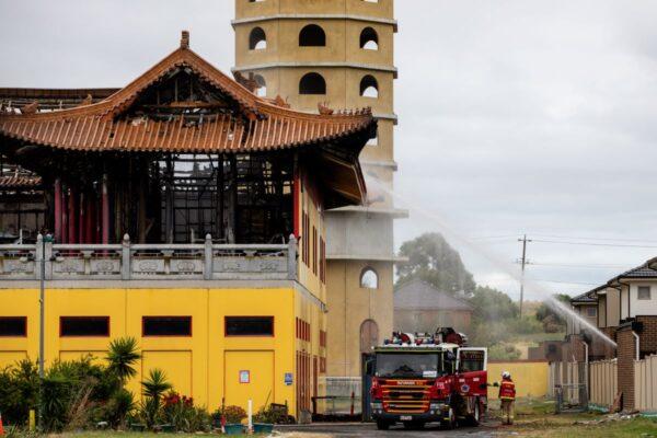 Firefighters are seen operating at the scene of a fire at the Bright Moon Buddhist Temple in Springvale South, Melbourne. Eighty firefighters have battled a blaze that has damaged the temple. Monday, February 6, 2023. (AAP Image/Diego Fedele)