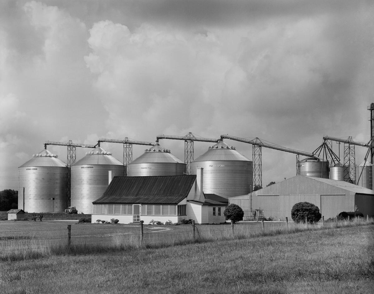 "Farmhouse & Grain Bins" in Pungo, Virginia, among Michael Wade's early photography taken in 1980. (Courtesy of Michael Wade)
