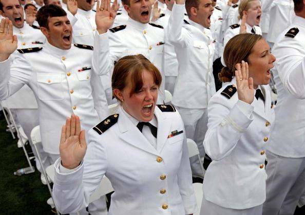 U.S. Naval Academy graduates Kristin Hope (C) and Jennifer Grijalva (R) are commissioned as officers in 2010. (Chip Somodevilla/Getty Images)