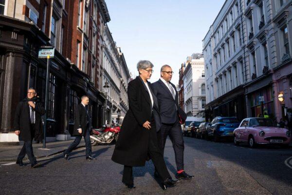 Britain's Foreign Secretary James Cleverly (R) and Australian Foreign Minister Penny Wong walk through central London on their way to Australia House after holding a meeting at the Foreign Secretary's official residence at Carlton Gardens in London, on Feb. 1, 2023. (Stefan Rousseau/Pool/AFP via Getty Images)