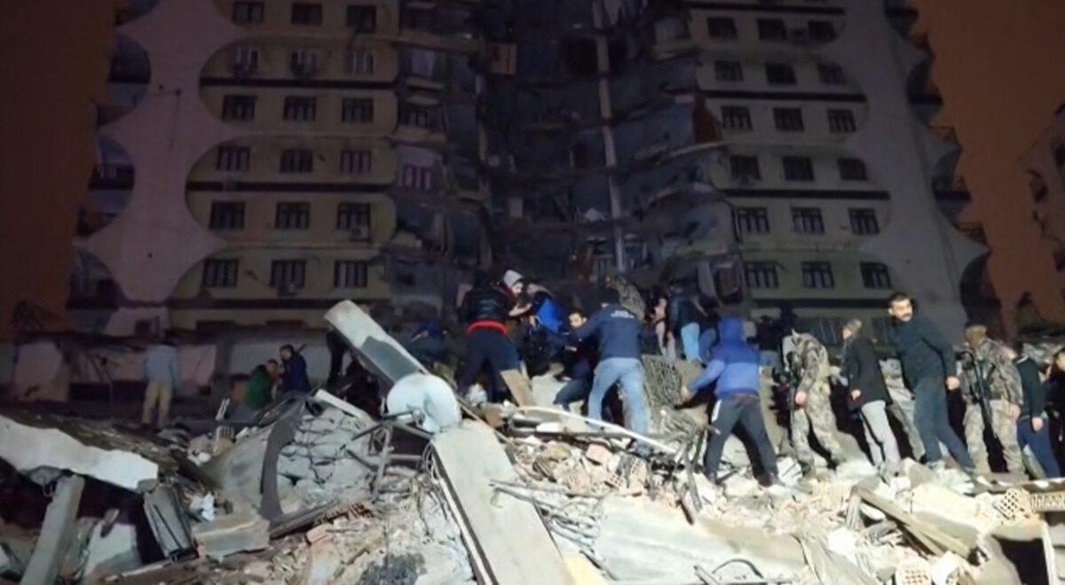 In this video grab from AFP TV, rescuers search for victims of a 7.8-magnitude earthquake that hit Diyarbakir, in southeastern Turkey, leveling buildings across several cities and causing damages in neighboring Syria, on Feb. 6, 2023. (Mahmut Bozarslan/AFPTV/AFP via Getty Images)