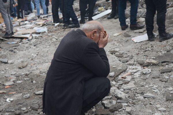 A man reacts as people search for survivors through the rubble in Diyarbakir after a 7.8-magnitude earthquake struck Turkey's southeast on Feb. 6, 2023. (Ilyas Akengin/AFP via Getty Images)