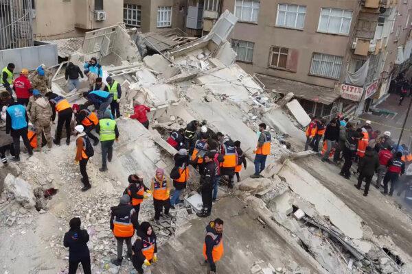 Rescuers search for survivors through the rubble in Sanliurfa, after a 7.8-magnitude earthquake struck Turkey's southeast on Feb. 6, 2023. (STR/AFP via Getty Images)
