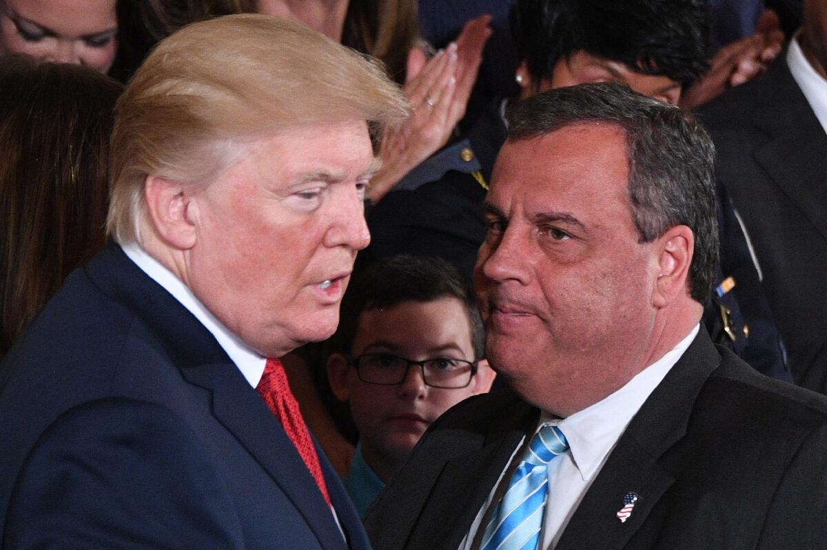 President Donald Trump (L) speaks with Gov. Chris Christie (R-NJ) after he delivered remarks on combatting drug demand and the opioid crisis in the East Room of the White House in Washington on Oct. 26, 2017. (Jim Watson/AFP via Getty Images)