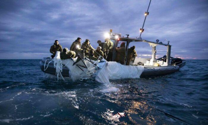 Sailors assigned to Explosive Ordnance Disposal Group 2 are seen working to recover the balloon near South Carolina's coast on Feb. 5, 2023. (U.S. Navy Photo by Mass Communication Specialist 1st Class Tyler Thompson)