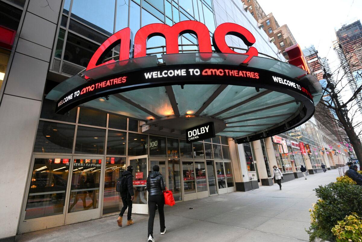 People walk by the AMC 34th Street theater in New York on March 5, 2021. (Evan Agostini/Invision/AP)
