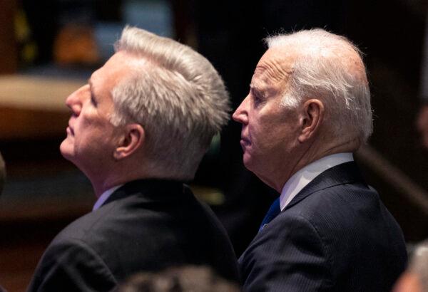 U.S. President Joe Biden sits next to Speaker of the House Kevin McCarthy (R-Calif.) during the National Prayer Breakfast at the Capitol in Washington on Feb. 2, 2023. The National Prayer Breakfast is a yearly bipartisan event that brings together religious leaders and politicians for a morning of prayer and reflection. (Kevin Dietsch/Getty Images)