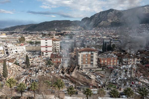 Smoke billows from the scene of a collapsed buildings in Hatay, Turkey., on Feb. 7, 2023. (Burak Kara/Getty Images)