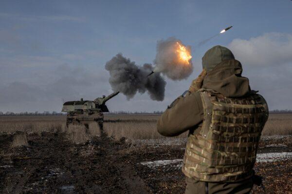 Ukrainian army from the 43rd Heavy Artillery Brigade fire the German howitzer Panzerhaubitze 2000, called Tina by the unit, near Bahmut, in Donetsk region, Ukraine, on Feb. 5, 2023. (Marko Djurica/Reuters)