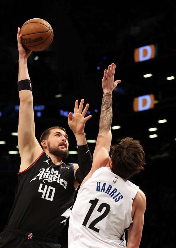 Ivica Zubac (40) of the LA Clippers shoots over Joe Harris (12) of the Brooklyn Nets during the 1st half of the game at Barclays Center in New York City on Feb. 6, 2023. (Jamie Squire/Getty Images)