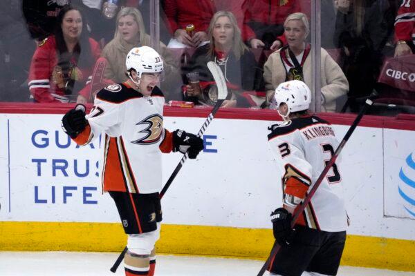 Anaheim Ducks' Frank Vatrano, left, celebrates his game winning goal with John Klingberg (3) during the overtime period of an NHL hockey game against the Chicago Blackhawks in Chicago on Feb. 7, 2023. (Charles Rex Arbogast/AP Photo)