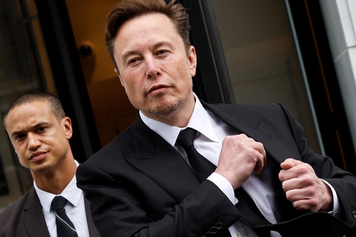 Tesla CEO Elon Musk and his security detail depart the company’s local office in Washington on Jan. 27, 2023. (Jonathan Ernst/Reuters)
