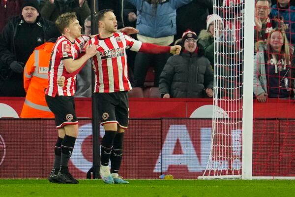 Sheffield's Billy Sharp (C) celebrates after scoring his side's second goal during the FA Cup 4th round soccer match between Sheffield United and Wrexham at the Bramall Lane stadium in Sheffield, England, on Feb. 7, 2023. (Jon Super/AP Photo)