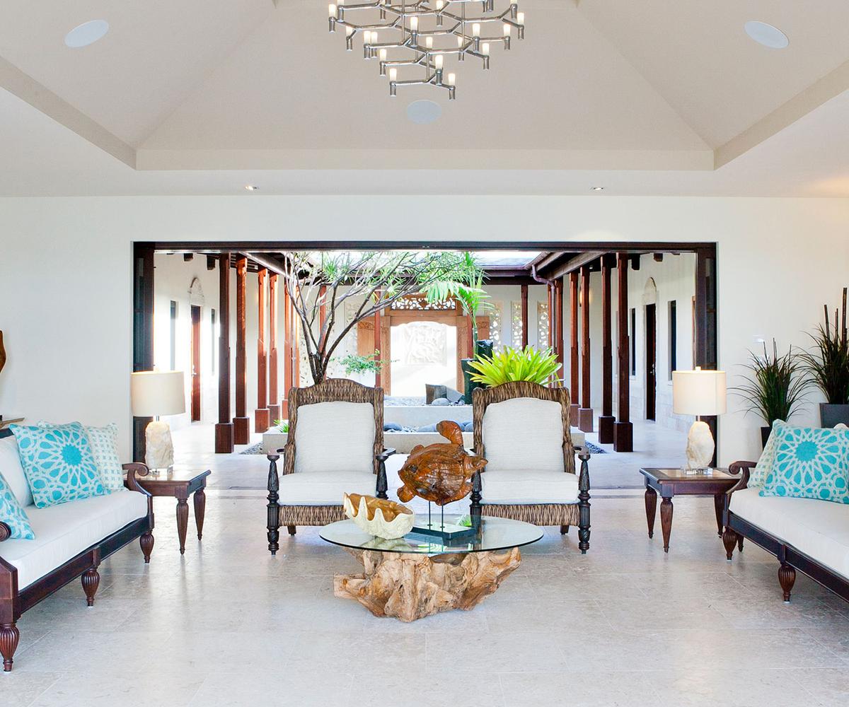 The open-air Balinese-inspired great room backed by the atrium provides a welcoming gathering space. (Courtesy of Sotheby’s Concierge Auction)