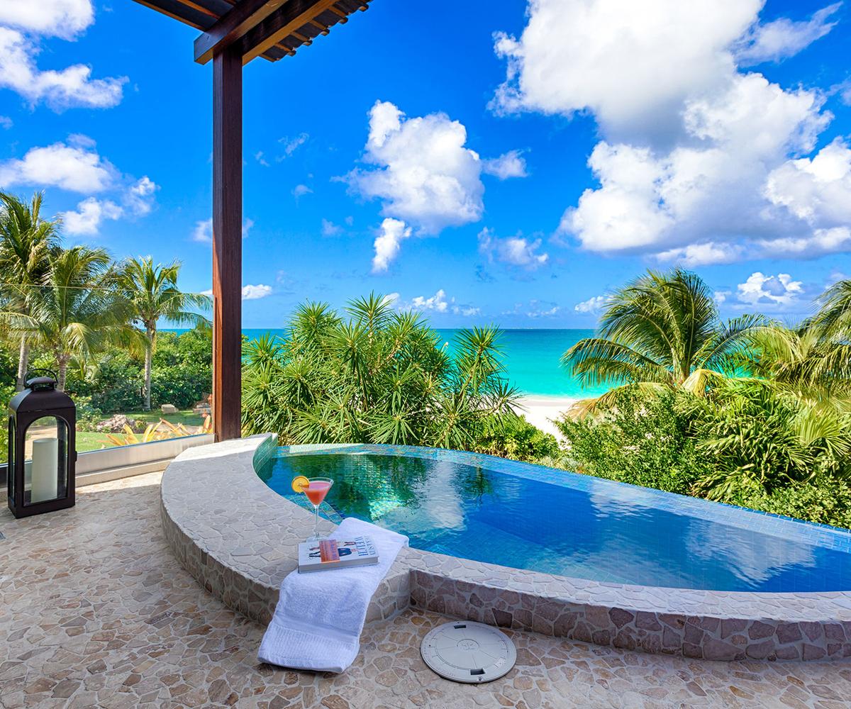 The master bedroom’s private spa overlooks the beach, and is screened by natural vegetation to ensure a tranquil experience. (Courtesy of Sotheby’s Concierge Auction)