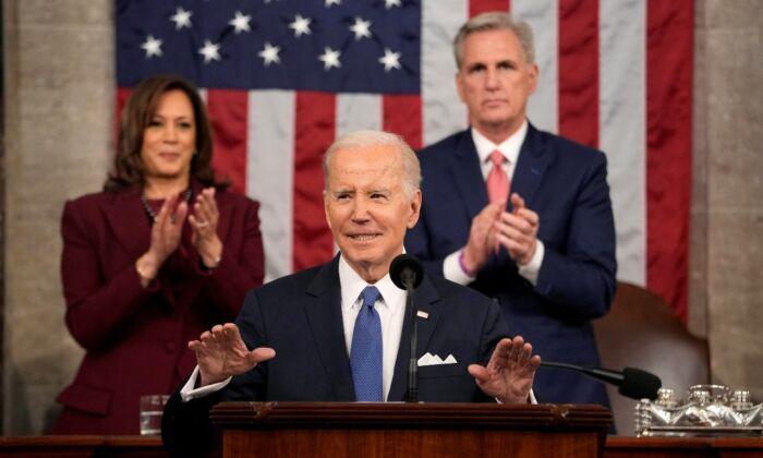 President Joe Biden delivers the State of the Union address  as Vice President Kamala Harris and House Speaker Kevin McCarthy (R-Calif.) rise to applaud, at the U.S. Capitol on Feb. 7, 2023. (Jacquelyn Martin/Pool via Reuters)