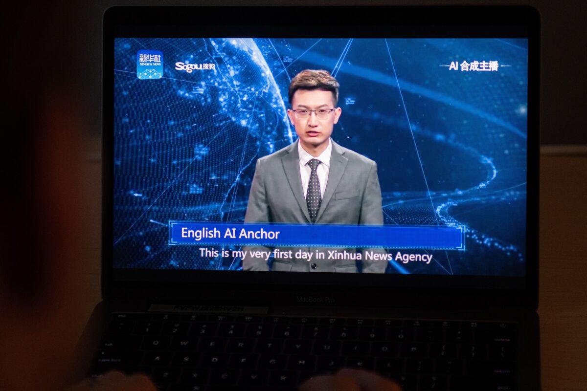 A man watches an artificial intelligence (AI) news anchor from a state-controlled news broadcaster on his computer in Beijing on Nov. 9, 2018. (Nicolas Asfouri/AFP via Getty Images)