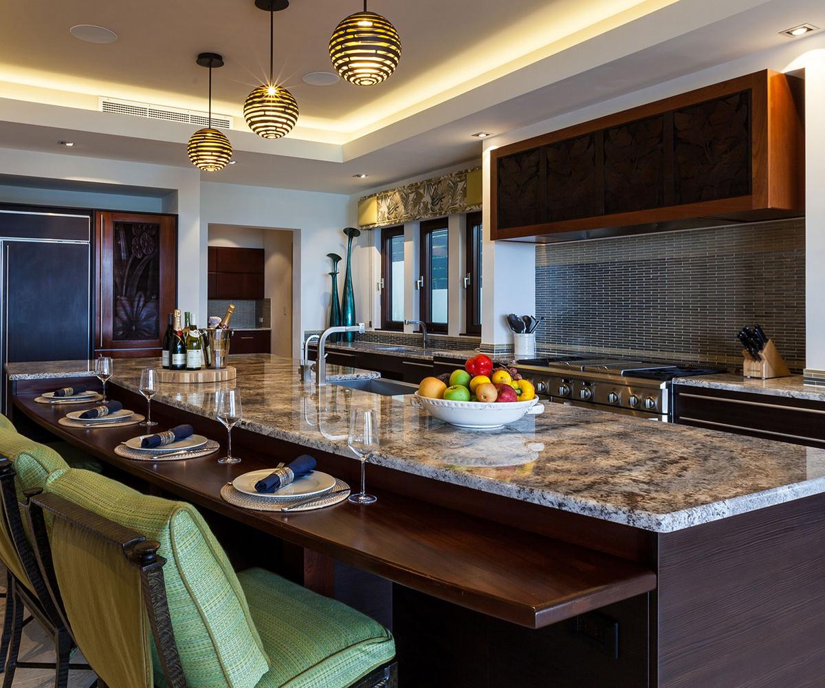 The villa’s gourmet eat-in kitchen features custom cabinetry, stone countertops and restaurant-grade appliances. (Courtesy of Sotheby’s Concierge Auction)